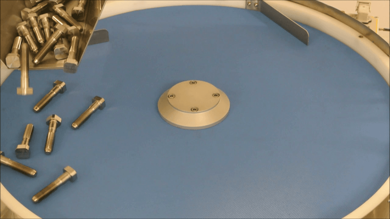 Separate screws using rotary feeder and robot